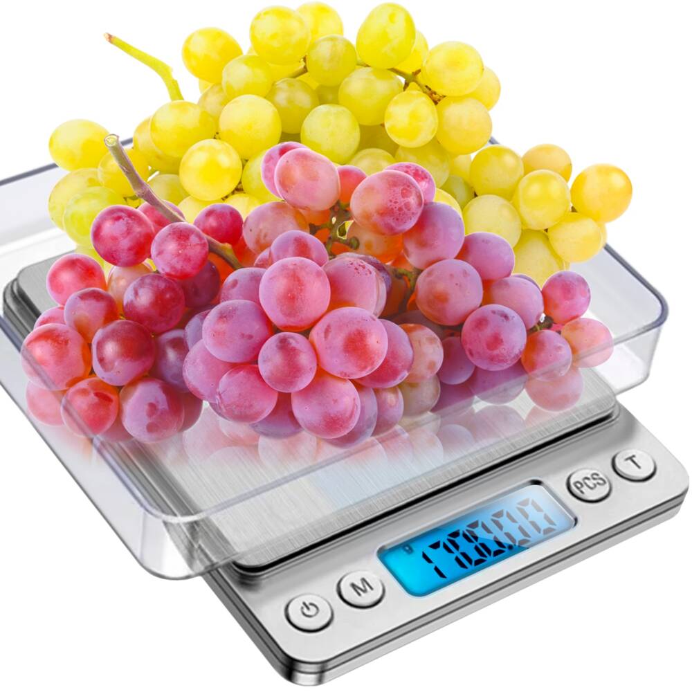 a scale with grapes on it